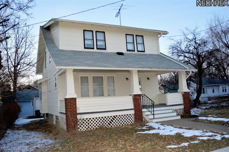 Welcome home to this charming colonial in Goodyear Heights. Some of the recent updates include newer roof, high efficiency furnace, insulation and hot water tank. Built in cabinetry surround the fireplace in the living room. The dining room features a built in window seat. The kitchen has an eat-in area. There's a bonus room on the second floor that can be used an office. This home offers hardwood flooring and spacious closets. There's a separate front, rear and side entry as well as a covered front porch.