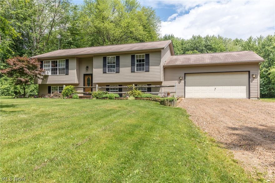 Show For Seconds!!! Very well maintained and super clean bi-level on over 3 acres of park-like yard. A hardwood foyer welcomes you to this nice home. The lower level family room includes a wet-bar and nice laminate flooring guest bedroom, full bath, and plenty of storage in the laundry room. The main level kitchen has oak cabinetry, pantry and don't miss the stainless steel appliances, additional 3 nice sized bedrooms and full bath as well. You'll love entertaining and barbecuing on the rear deck or paver patio this summer which is accessible through the sliding doors of the dining room. 2 car attached heated(2016) garage. 1 year home warranty included. Call today for your private showing!