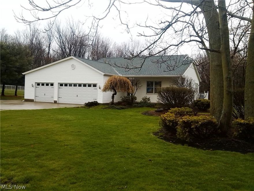 Pride of ownership shows in this move into perfectly clean & meticulous inside & out home! Modern ranch with 3 bedrooms, 2 bath, this is the one you have  been dreaming about out in a rural country setting. The car enthusiast, collector or mechanic will love the 3 car attached garage and the 3 car detached garage in rear, with concrete drives! Beautifully landscaped 3/4 acre lot with mature trees & shrubs,  private yard  with shed, backing into a wooded forest! Energy efficient  Geothermal heat & central air! Custom built for the original owners in 1992 among well maintained neighboring homes in the Austin Village development!  Enjoy sitting on the 22 Ft front porch side deck or side patio.  Ceramic entry to a bright cheerful open concept Great Rm 25 x22 Ft. featuring tall vaulted ceiling.  Well built has Anderson wood windows throughout & French doors to a side deck. Room to build onto the deck. Room to build on for or additional living space front, back & sides. Over 25 Ft of oak cab