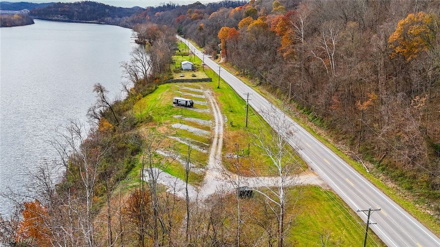 Own your own campground or transform this unique property into a stunning riverfront residence. Situated on 4.4 acres, this property offers breathtaking river views and endless opportunities. Currently configured with 10 private camping sites, with plenty of room to add more if desired. Features include a 3,000-gallon pump station and the peace of mind of being located out of the flood zone. A rare find with exceptional potential—don’t miss out on this versatile investment!