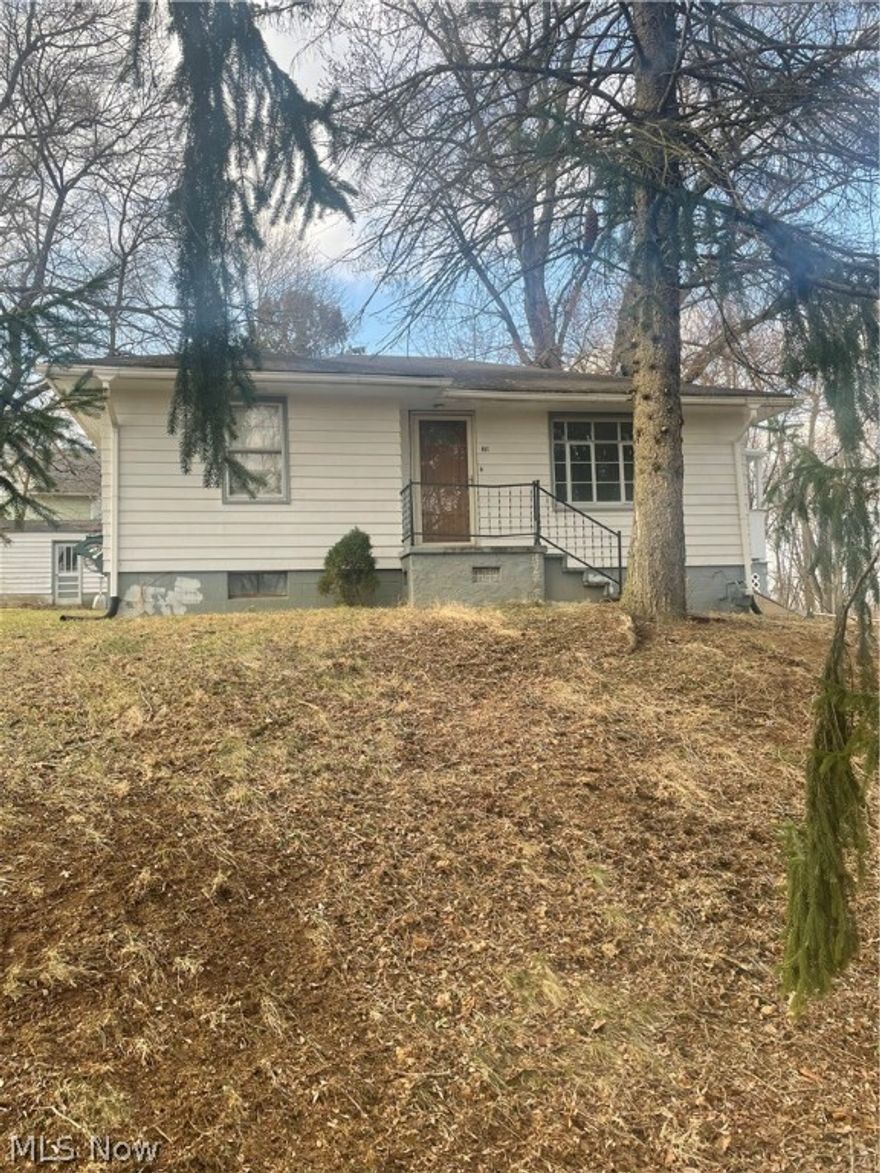 Cute and Cozy 2 bedroom ranch home in Lacroft.  Natural Hardwood floors in livingroom, hallway and both bedrooms. Basement has two additional rooms and a laundry area with a washtub. 1 car detached garage with concrete floors. Hot water tank is owned. Gas bill average is $80, Electric average is $100 and the Water/Sewer/Trash runs approx. $93. Road is well maintained in the winter months.