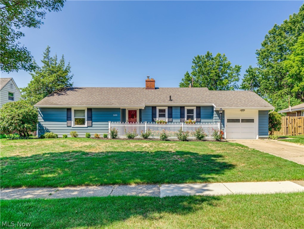 If you have been waiting for a “white picket fence” moment while looking at homes, stop your search. This stunning ranch is located in one of the most sought-after neighborhoods in Cuyahoga Falls and has both outside curb appeal and inside charm. A brick walkway leads to an inviting entrance. Open the door to a foyer that leads you to the large 25 x 12 living room, dining room combination that offers a wood burning fireplace with a detailed wood mantle, a large picture window, and wood flooring under carpeting. If you prefer lots of countertop and cabinet space, you are going to love this fabulous kitchen. Totally redone just two years ago it boasts Quartz countertops, seamless sink, top of the line cabinetry, spacious pantry, range hood with stainless steel backsplash, subway tile, ¾” hardwood flooring and can lighting. All stainless-steel appliances will remain. The spacious master bedroom offers two closets and wood flooring under carpeting. The second bedroom is nicely sized, an