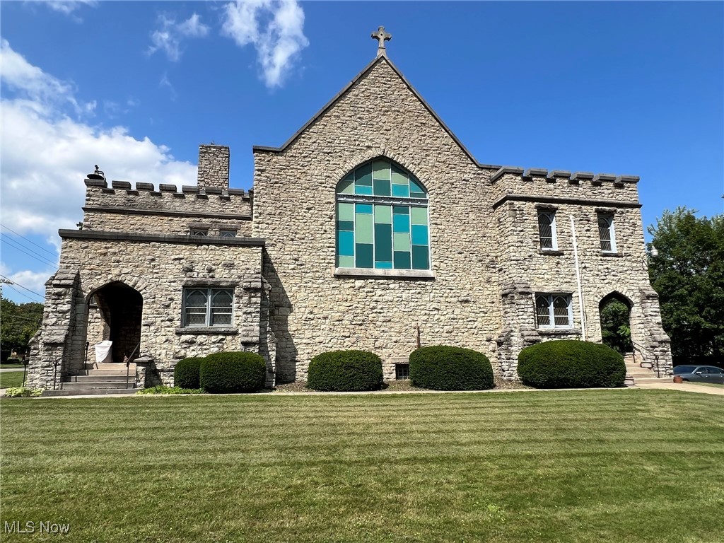 Reduced for quick sale! Historic Youngstown Stone Church For Sale! This Striking Building sits on 2 parcels of land and features ornate exterior
and interior architecture. Former "Richard Brown United Methodist Church". 4400 SF. Church Built in 1905. Charles
Owsley, Architect. Main entrance features tiled entry way into large parlor room. Front staircase leads to large room with
fireplace with adjacent half bath. Large worship area seats 130+. Pews included. Back staircase leads to 2 upstairs rooms.
Spacious basement has marble fireplace, large seating area, commercial kitchen with island. Commercial stove and
ventilation included. 2 Public restrooms in basement. Ample parking. Short walking distance to YSU, and is situated
directly across from Wick Park. New (3) Heat Pumps (Heat, AC or fan) , updated 200 amp electrical service, shingled roof
estimated to be less than 10 years old. Flat roofs were serviced by Boak & Sons. Zoned as MU-I Mixed Use institutional.
Please view virtual tour before requesting a showing. Please contact agent for more information, virtual tour and
showings.