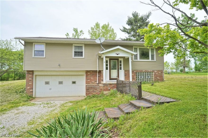 WOW! Come on into this fabulous, updated split level three-bedroom, two full bath home which has new flooring, modern lighting, been freshly painted, and new blinds throughout. You will find a large open living room, dining area which has doors to the back deck and views of the tranquil backyard. The gorgeous and bright kitchen has been totally redone offering new cabinets, countertops, appliances, flooring, built in microwave. There are three bedrooms with new carpet, freshly painted and two full bathrooms which have been redone. The master suite bathroom has been gutted and redone offering new everything-toilet, shower, counters, lighting, flooring. The lower level has new carpet great space for entertaining, office, work out area etc. There is an unfinished area great for storage etc. Two car attached garage. The beautiful backyard sitting is on 1.4 acres of pristine property and is just fabulous for a firepit, relaxing, or entertaining. So many precious memories begin right here!