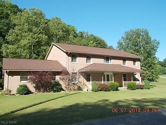 2 STORY BROCK HOME WITH 6 BEDROOMS AND 2 -1/2 BATHS.1.70 ACRES OF GROUND IN COUNTY SETTING.HOME HAS KITCHEN ISLAND ANDEAT IN KITCHEN.ALSO COULD COMBO LIVING ROOM FOR LARGE DINING ROOM.2 MINUTES FRON STATE ROUTE 7. CLOSE TO COUNTY MARKET.MUST SEE INSIDE HOME.UNFINISHED BASEMENT FOR RECROOM AREA OR JUST MORE STORAGE.FRONT AND REAR PORCHES AND REAR DECK.
