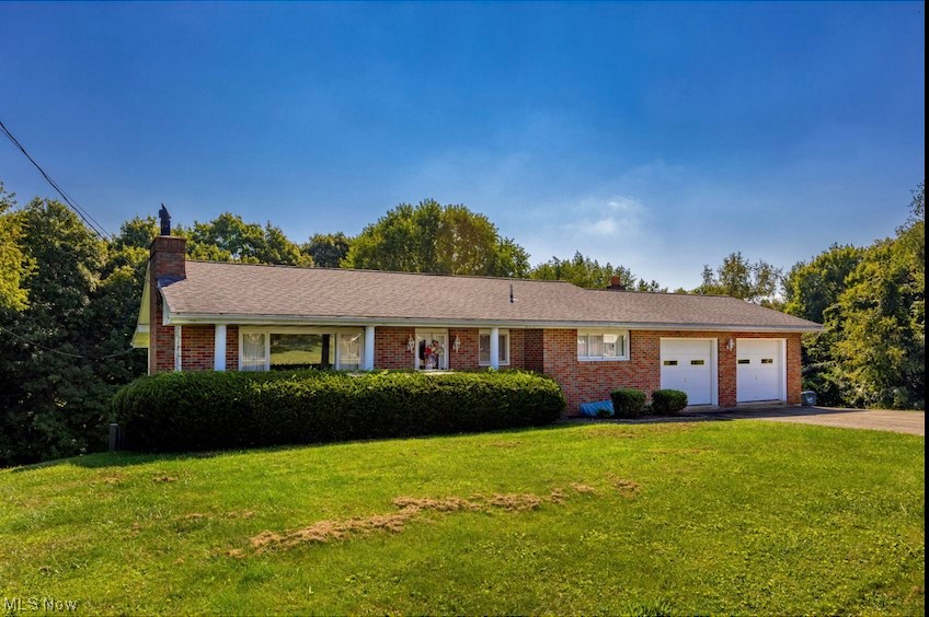 Eye catching brick ranch home on 3.78 acres! Beautiful treed parcels to enjoy. Living room and dining room have large picture windows (custom cornice boards) for lots of natural light. Nice floor plan with 2 bedrooms and 2 baths. Wood floors in bedrooms. Large screen deck off of the eat in kitchen that includes appliances. The lower level has multiple rooms for recreation, office, exercise or hobby rooms plus storage and walks out to a covered patio. Full bath, laundry. wood burning stove area are in the lower level. Nice parking area and a 2 car garage. Ready for you to move in! Home Warranty