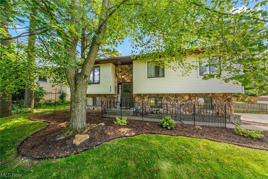 Welcome home to this beautiful bi-level full of character and charm! The main level features vaulted ceilings and a striking floor to ceiling Stone accent, 3 bedrooms and a recently remodeled full bathroom. The living room boasts a large window allowing an ample amount of natural light to gleam in. The dining room is open to the living room, and offers a slider to the large deck overlooking the park-like backyard. The eat-in kitchen comes equipped with stainless steal appliances, and an abundance of cabinet storage. Vaulted ceilings continue into the main bedroom which offers a second slider to the backyard and deck. The lower level provides another living room, half bath, laundry room, and a bonus area that could be used as an office, playroom, workout area, etc. There have been many updates throughout.
Enjoy sipping your morning coffee while watching hummingbirds, or weekend barbecues on the raised deck which overlooks the peaceful, fully fenced in back yard. There is plenty of