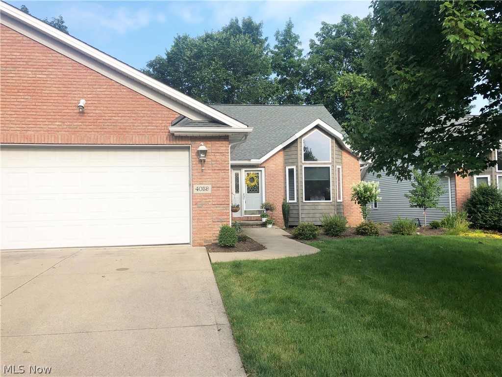 Welcome to 4058 Eagle Drive in Medina! Two bedroom, two-and-a-half bathroom cluster home in Courts of Weymouth with a spacious, open floor plan that is on the 2nd hole. The living room has beautiful features including vaulted ceilings, a ship-lap fireplace, and an accent glass block window. Sunroom has Cathedral ceilings, lots of windows, and a sliding glass door that leads to the wooden patio that has golf course views. The eat-in kitchen has gorgeous counter tops, wood floors and cabinets, and a convenient breakfast bar offering extra seating. Owner’s suite has Cathedral ceilings, access to the patio, a walk-in closet with built-ins and a private bath. Convenient first-floor laundry. The lower level is partially finished and has a rec room, half bath, and office. All residents must hold minimum residential social membership at the Weymouth Country Club. This is every golfers’ dream! Make an offer today!