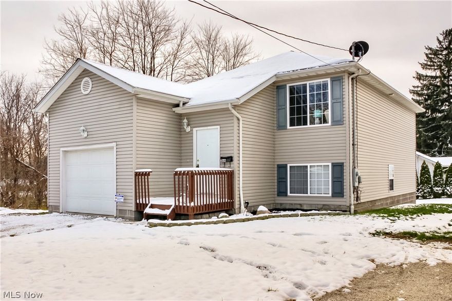 Welcome home!  This property boasts so many desirable features!  Built in 2005, you will enjoy the modern updated kitchen with an open concept layout with sight lines into the dining room and the bright and sunny living room.  Dining room has sliders out to the lovely deck overlooking a wooded lot. Down the hall you will find a fully remodeled Jack and Jill bath that connects to a spacious master bedroom with dual closets,  This main floor has an additional nicely sized bedroom with ample closet space.  The walk out lower level features a 3rd bedroom, also with great closet space, as well as a HUGE family room/media room with sliders out to the back paver patio!  This level also features a second totally remodeled full bath, a spacious laundry room and plenty of additional storage space.  You will enjoy the attached one car garage as well!  The entire home has been freshly painted and has updated flooring, backsplashes and bathrooms.  So much house at such an affordable price point!  D