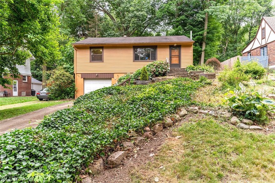 Welcome Home to this West Akron Charmer! Fantastic raised ranch boasts many updates throughout! Bright and sunny living room opens to the eat in kitchen with stainless appliances. Nicely sized bedrooms with good closet space. Updated bathroom.  Walk out lower level with limitless potential opens to a  very private back yard oasis. Front yard landscaping prepped and ready to become your dream garden! Oversized one car attached garage offers plenty of storage.  Replacement windows throughout, water tank in 2020, furnace in 2018, A/C in 2018, garage door and opener in 2012, gutters and downspouts in 2005, newer exterior doors, and updated electrical. All of this in a home situated in a highly sought after neighborhood. Don't miss this one!