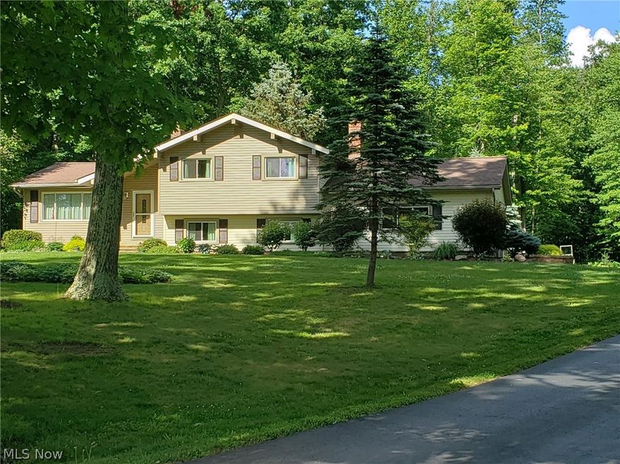 This beautiful home sits on 3 acres in a park like setting. You will notice right away how well this home has been lovingly maintained. 
The yard is landscaped and boasts beautiful bright flowers.