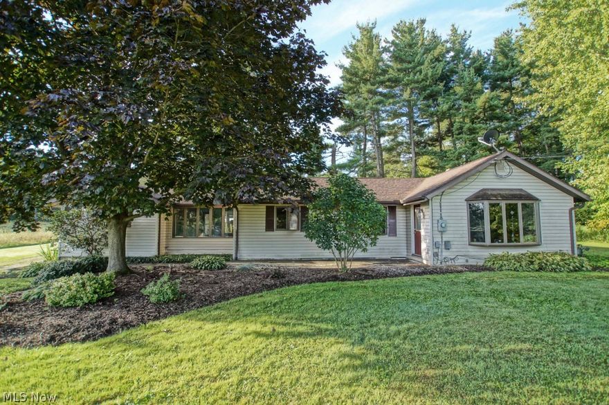 Beautiful renovated Ranch home on 5 acres of land yet in close proximity to Routes 21 and 77 (Fairlawn shopping area). There is a huge pole barn 
( 31x33/ 28x21 )  on the property with electricity and concrete floor, and a second barn ( 25x15 ) Other highlights include beautifully refinished hardwood floors throughout, a wood burning fireplace, a completely remodeled kitchen with new appliances, counter tops, cupboards and ceramic tile flooring and a remodeled bath. New garage door, man doors, storm door, and new well tank. Basement is waterproofed with a lifetime guarantee that transfers to new owner. A must see if you're looking for land and a fully updated home. Free 1 year warranty included with purchase...