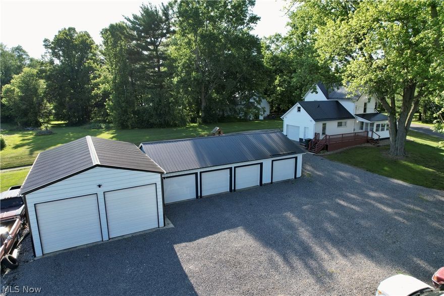 Attention Mechanics and Car Enthusiasts! Your Dream Property Awaits! Discover the ultimate haven for mechanics and car enthusiasts with this exceptional updated 2-story home featuring a turn-key mechanics shop. Situated in a prime location, this property offers the perfect blend of residential comfort and professional workspace, making it a rare find for those seeking both convenience and functionality. Home highlights include: Solid 2-story home with numerous updates throughout. New roof, siding, front deck, and rear patio. Upgraded first-floor bathroom and laundry facilities. Newly renovated kitchen boasting cherry cupboards and modern appliances. Cozy pellet stove for added warmth and ambiance. Spacious enclosed front porch, perfect for relaxation or entertaining. Three bedrooms and a full bath on the second floor. Attached one-car garage with convenient access to the house
New rear patio area, ideal for outdoor gatherings and leisure activities. Included are two Canon 64 gun safes for added security and peace of mind. All roofs replaced in 2020, decks built in 2020, ensuring longevity and durability. Shop highlights: Four standard garage spaces with concrete floors and new insulated garage doors. Additional two-car garage built in 2021 featuring two installed lifts (FWD 10k lift and Tuxedo 12k lift) Insulated, heated, and cooled workshop providing the perfect environment for working on vehicles. Ideal setup for building dream vehicles or engaging in DIY automotive projects. Ample gravel parking area and wrap-around driveway for easy access and maneuverability. Conveniently located in the rural Navarre area and within 10 minutes to local amenities. If you've been searching for the perfect property to fulfill your automotive passions, look no further! This meticulously maintained home with an impressive mechanics shop is ready to exceed your expectations. Schedule a showing today and seize the opportunity to make this exceptional property your own!