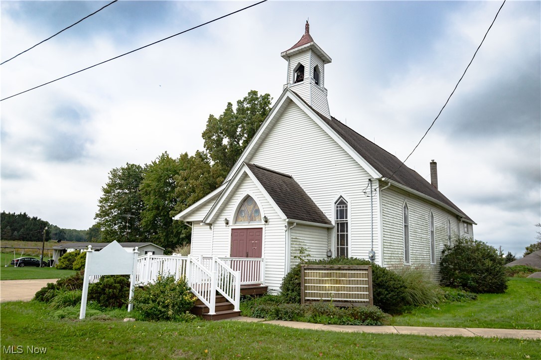 Many possibilities with this beautiful, 1,718 sq. ft. former Church property located just outside of Orrville in Baughman Twp. The handicap accessible entryway features a small foyer area with a 1/2 bath before you enter the large open sanctuary with 20 pews for seating and a small raised alter. There is a carpeted room behind the alter and a stairway leading to the 2nd floor office or gathering room. The utility room has an updated high efficiency furnace, A/C and storage space. This property has a cement parking lot, a storage shed, public water, septic system and it's only 3.5 miles from Route 30. Baughman Twp. has no zoning so there are endless possibilities with this property.