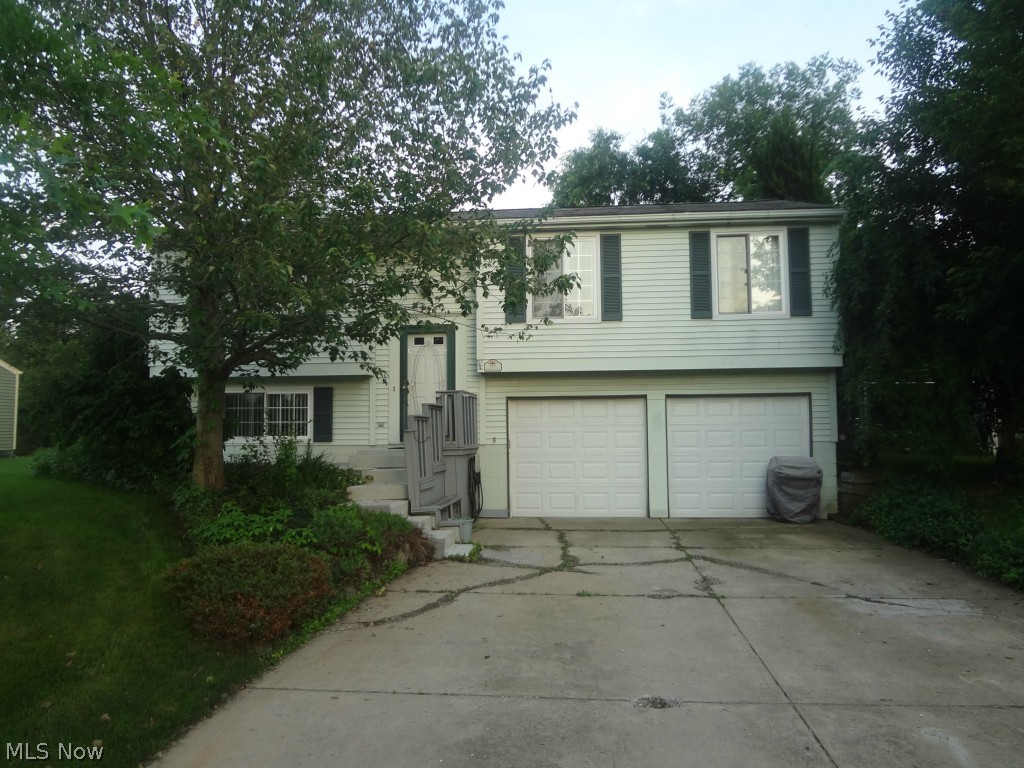 Make this three bedroom, 1.5 bath, bi-level your next home. Nice open living room/dining area combination. Kitchen with ceramic flooring. Sliding doors from the dining area overlook the multilevel deck and parklike backyard which is totally fenced. The shed has an L shaped fenced pet area. The lower level consists of a large family room, 1/2 bath, and laundry/utility area. The double attached garage will keep you out of the elements. Great Champion neighborhood, dead-end street. Make your appointment today!
