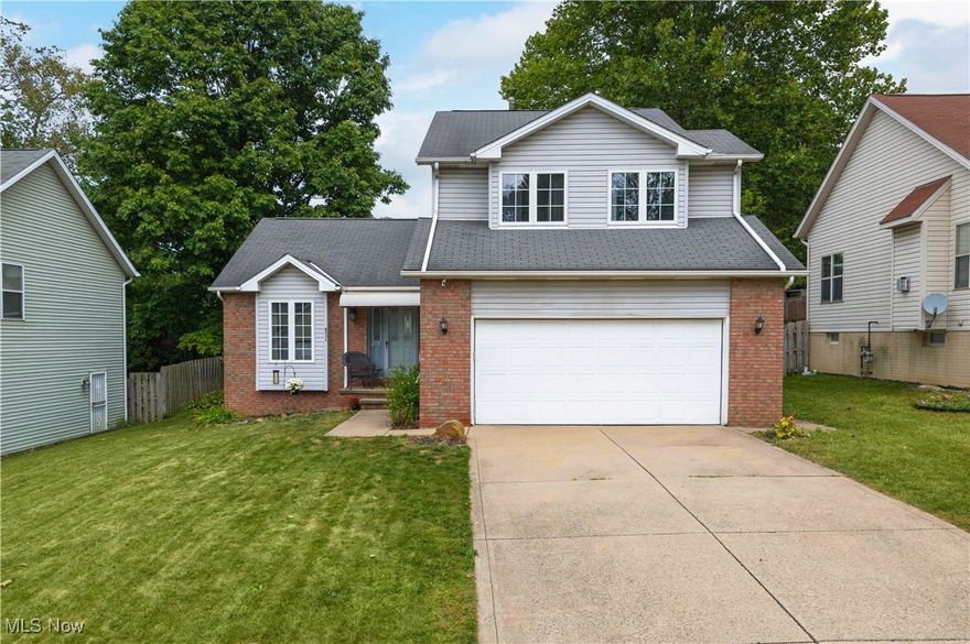 Welcome to 8531 Cherie Drive! Tucked away on a private cul-de-sac in the desirable newer construction community of Dicon Development, this beautifully maintained colonial offers over 2,100 sq. ft. of living space. Step inside to a bright foyer with vaulted ceilings and abundant natural light, freshly painted throughout. Just off the entry is a versatile room, perfect for a home office, den, or formal dining space. The heart of the home is the oversized eat-in kitchen, featuring soaring ceilings, plenty of cabinet storage, and new stainless steel appliances (2023) that convey. Sliding doors open to your private deck overlooking the expansive backyard, ideal for entertaining or relaxing outdoors. Adjacent is the warm and inviting family room with a cozy fireplace, plus a convenient half bath and access to the attached two-car garage with durable nature stone flooring. The finished basement provides even more space, complete with partial nature stone flooring, a large laundry area, and multiple storage rooms. Upstairs, enjoy brand-new luxury vinyl flooring (2023) throughout. The primary suite boasts a walk-in closet and full bath, while two additional bedrooms and another full bath complete this level. Updates include: fresh paint throughout, new appliances and garbage disposal (2023), new LVP flooring (2023) new light fixtures, plumbing fixtures and toilets throughout, new ring cameras and an invisible fence for furry animals. Don't miss this opportunity, your dream home at 8531 Cherie Drive is ready to welcome you!