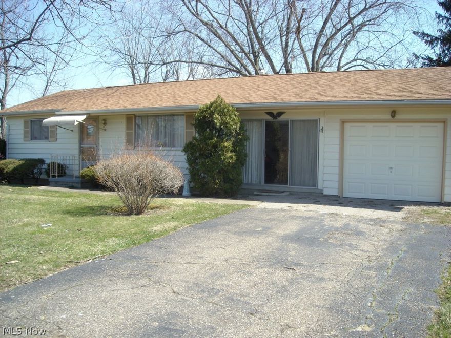 2 bedroom, 1 bath with partially finished basement and enclosed breezeway - one car garage, great location facing ZCC Golf Course.  Priced to Sell.