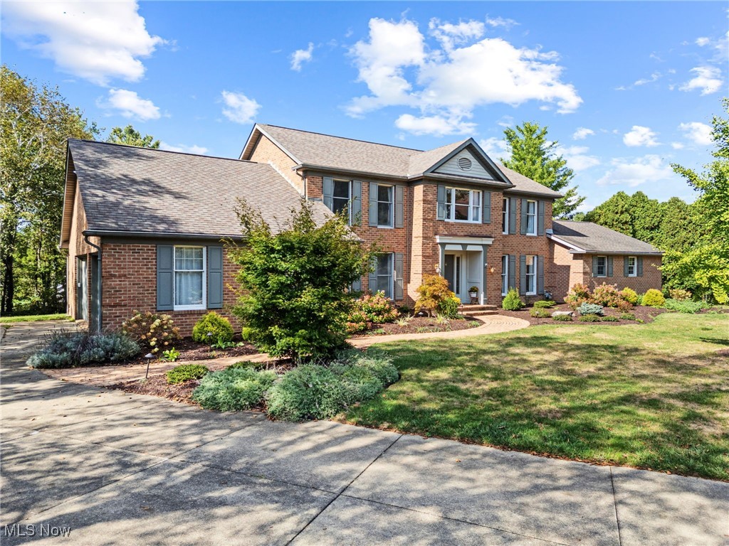 Welcome to this stately colonial home nestled at the end of a cul-de-sac. This home offers a lot of living space with 5 bedrooms, 3 full and 1 half bath, large eat-in kitchen that is open to a large great room with vaulted ceilings, fireplace, wet bar, and built ins. It also opens to beautiful 4 season room! Separate living room, dining room and library off of spacious foyer. Upstairs you'll find master suite with dual closets and private bath with walk in shower, tub and vanity. 3 other bedrooms and a full bath. There is an Additional Living suite on the main level that includes a living area with fireplace, small kitchen, pantry, walk in closet, and private bathroom with walk in shower and French doors to private deck overlooking beautiful landscape. Finished lower level with fireplace. 3 car side load garage with charging station for electric car. This home has lots of beautiful woodwork and is great for entertaining! Conveniently located!