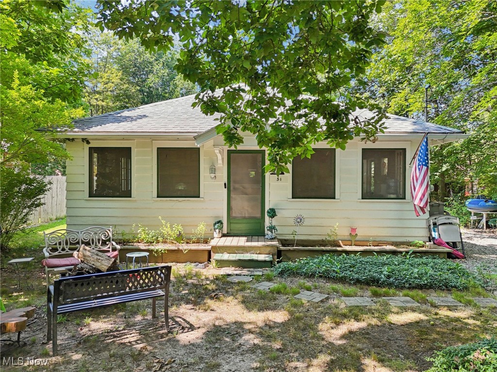 The address is 105 Hartzell Rd. It used to be Cottage #51 Hartzell Rd. This property is NOT part of the Berlin Lake Golf & Swim Club and that is located directly across the street. You do not have an HOA and you are not mandated to join as a member. It is optional. They have a golf membership and the social membership costs less. The social membership includes swimming with heated pool. The seller will sponsor you as a member and pay for one year membership for the buyer. Lake inlet is behind the cottage. No dock.