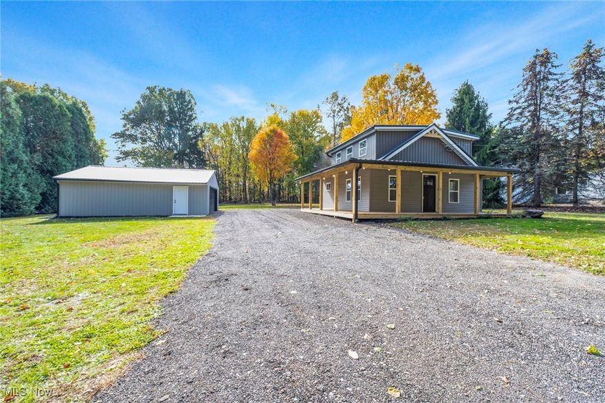 Welcome to 5111 W Middletown Road in Canfield, a beautifully rebuilt two bedroom, one and a half bath home sitting on nearly three quarters of an acre in the desirable South Range School District. This property has been completely gutted and redone from top to bottom, offering the charm of a country setting with all the benefits of brand new construction.
The second floor was expanded to include two spacious bedrooms and a full bathroom. Nearly everything in this home is new, including the roof, framing, siding, windows, doors, plumbing, wiring, and 200 amp electrical service. The first floor features new hardwood floors throughout, while the second level offers new carpet for a comfortable finish.
The open kitchen flows seamlessly into the main living area, perfect for entertaining. A first floor laundry and half bath are conveniently located beside the kitchen. Step outside to enjoy the wrap around wood porch, which extends from the driveway to the front entrance and overlooks the peaceful surroundings.
The two car garage has been completely rebuilt with new walls, a man door, garage door, and roof. The well has been re-dug with a new pump installed, and the septic system has been updated for peace of mind. The property has also been thoughtfully regraded, with a new culvert and grass covered ditch, and over thirty trees have been removed to open up the landscape and improve drainage.
All the work has been done. Just move in and enjoy this quiet, country style retreat that is only minutes from everything Canfield has to offer.