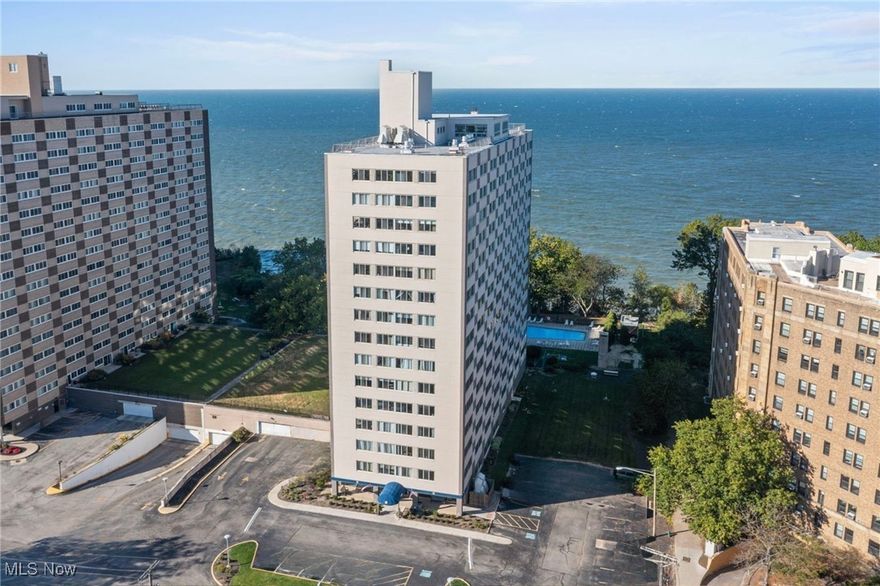 Completely updated 2-bedroom, 2-bath corner unit in Marine Towers East, ideally located along the Lake Erie Waterfront of Lakewood's historic Gold Coast. The open floor plan features neutral luxury vinyl plank flooring throughout and wraparound windows that flood the living and dining areas with natural light. An updated eat-in kitchen includes all stainless steel appliances, a large center island with ample storage, granite countertops, and a tile backsplash. The primary bedroom offers a walk-in closet and updated en-suite bath with a custom-tiled walk-in shower, while the second bedroom and updated full bath with a bathtub provide flexibility for guests, home office, or additional living space. INCLUDING all appliances (except microwave) and all custom light filtering window blinds. Residents of Marine Towers East enjoy an extensive list of amenities and services included in the monthly association fee, including heat, air conditioning, water/sewer, trash, and laundry facilities on each floor. The building features a heated parking garage with optional assigned spaces, ample guest parking, secure entry, a welcoming lobby mail room, a secure package room for deliveries with 24/7 access to prevent package loss, and shopping carts in the garage for transporting groceries. Lifestyle amenities include a rooftop deck with panoramic lake and city views, outdoor in-ground pool, picnic areas with gas grills, a party room for larger gatherings, and a rentable guest suite for overnight visitors. Additional conveniences include a fully fenced dog run, optional storage lockers, bicycle storage, and a DIY car wash station within the garage. The prime location offers easy access to US-20, Lakewood’s vibrant dining and shopping, Metroparks, and all that Cleveland’s west side has to offer.