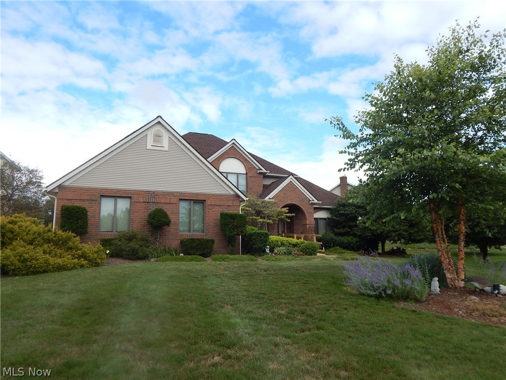 Comfortable stylish first floor master Colonial. Unsurpassed quality featured throughout. Spectacular two story great room, featuring brick gas fireplace, master crafted wood work, palladium windows, comfortable living. Enjoy the oversized master suite on first floor, relax in comfort and style with the updated master bath. Handicap assessable unsurpassed glamorous walk in shower. Second floor offers beautiful loft and three comfortable size bedrooms. Luxurious granite kitchen with sliding door to screened in porch, deck and many out door features. Enjoy the family comfort of lower level, partial finished, plenty of storage and quality structure. Central Vac- system, wired security, oversize side entry garage. Updated roof and move in ready!!!