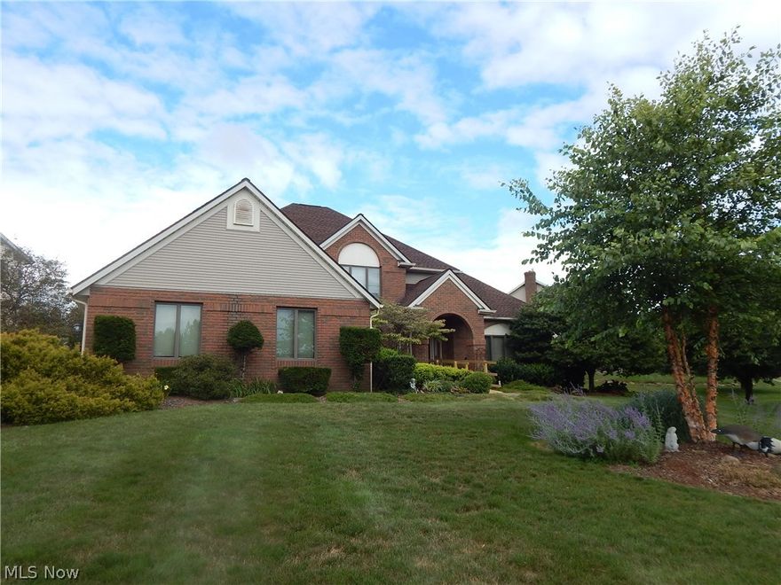 Comfortable stylish first floor master Colonial. Unsurpassed quality featured throughout. Spectacular two story great room, featuring brick gas fireplace, master crafted wood work, palladium windows, comfortable living. Enjoy the oversized master suite on first floor, relax in comfort and style with the updated master bath. Handicap assessable unsurpassed glamorous walk in shower. Second floor offers beautiful loft and three comfortable size bedrooms. Luxurious granite kitchen with sliding door to screened in porch, deck and many out door features. Enjoy the family comfort of lower level, partial finished, plenty of storage and quality structure. Central Vac- system, wired security, oversize side entry garage. Updated roof and move in ready!!!