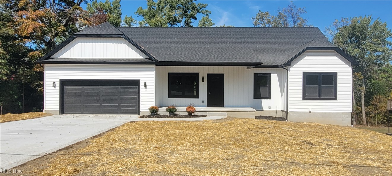 Discover this stunning newly built 4-bedroom, 3-bath ranch in Munroe Falls, featuring 1,560 sq. ft. on the main level plus 1,230 sq. ft. of beautifully finished walk-out basement space. The kitchen is a true centerpiece with white cabinetry, a large island, stainless steel GE appliances, and elegant quartz countertops—carried seamlessly into all three full bathrooms and the lower-level kitchenette, which also includes matching GE stainless appliances. The main floor showcases hickory hardwood floors, vaulted ceilings in both the living room and master suite, stylish feature walls, and oversized trim with casing throughout. The master suite impresses with a walk-in closet featuring upgraded shelving and a dressing bench, as well as a bath with a double vanity. Additional thoughtful touches include ceiling fans in every bedroom and the living room, along with a 12x16 deck off the dining room. The natural light-filled walk-out lower level offers a very spacious 26 x 21 family room, bedroom, full bath, kitchenette, and access to a 16 x 12 concrete patio. Built with 2x6 construction, blown-in insulation, a 50-gallon hot water tank, insulated garage walls/ceiling/door, and 200-amp service, this home also features a 2-car garage deep enough to accommodate a third vehicle or provide extra storage. Combining modern design, quality craftsmanship, and exceptional functionality, this property is truly a must-see.