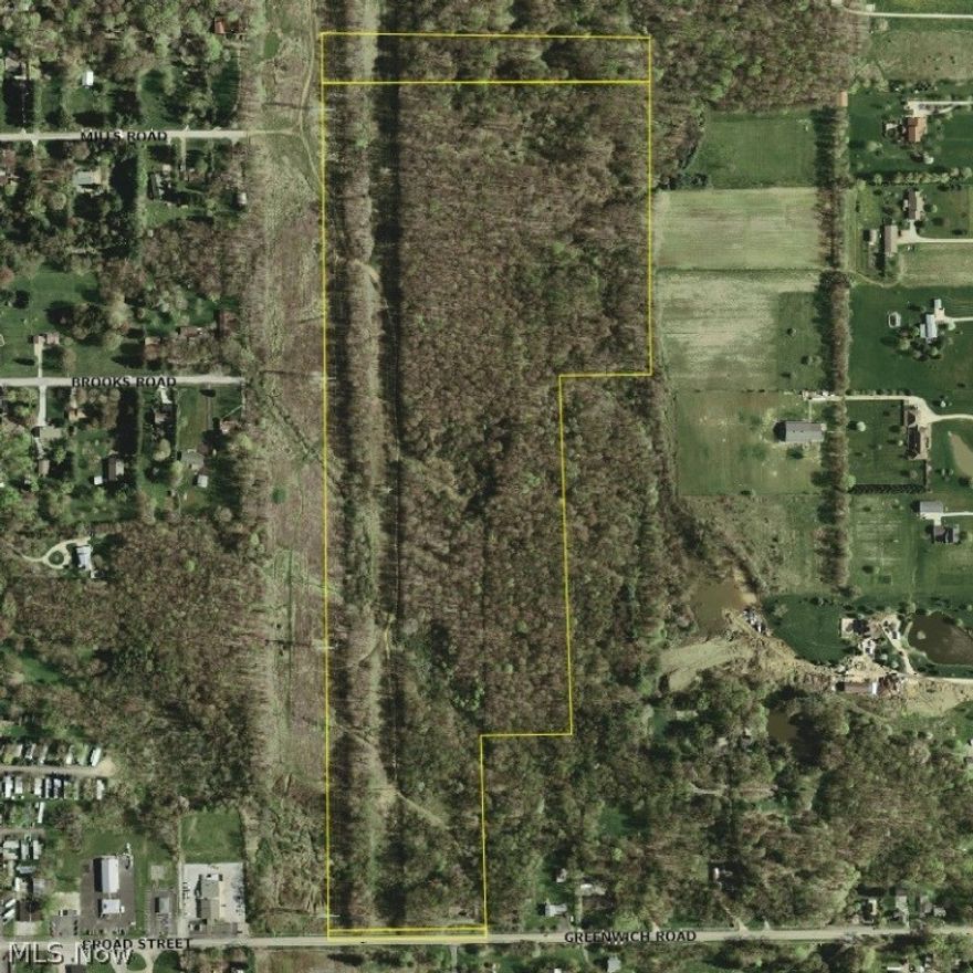 Three Large Parcels of Vacant Land containing a total of 70.403 Acres with Trees, Slopes and Open Terrain abutting the east side of the City of Wadsworth in the southeast corner of Medina County, Ohio!  40+ Acres are wooded with a Stream flowing through the property.  The western portion of the land has a utility line easement that runs from the road right-of-way on the south side of the property, north 3,334 feet.  Three gas/oil wells are known to exist on the property - one well is producing a small royalty.  An abandoned coal mine is shown to exist on one of the parcels of land, as shown on the Medina County Tax-Map.  All mineral rights/lease rights will transfer to the buyer at closing.  (There are no official post office addresses assigned to the three parcels yet, so the 1000 Greenwich Road address is estimated based on the addresses assigned to the abutting parcels, just to make it easier to find the property.)  This is a rare opportunity to purchase a large, undeveloped tract o