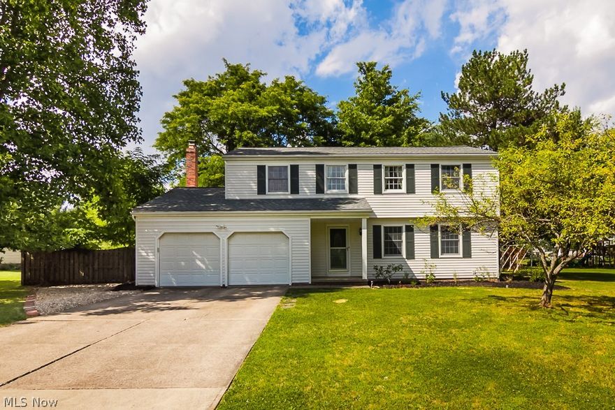 Your search stops here...if you're looking for a colonial style home on a cul de sac where your home is set back far enough from the street, yet there is still ample patio and backyard...this is it!  Just pull into the paved driveway with attached two car garage and then step onto the porch and into the comfortable, carpeted living room.  There is a formal dining room and just off the kitchen with stainless steel appliances. (Hardwood floors under LR and DR, as well as on second level.) The family room with fireplace has a sliding door that leads to the backyard patio.  There is also an area to the right of the patio all ready for gardening.  The second floor of the home features four spacious bedrooms with ample closet space and two baths.  And, of course, there are those little touches, like, built-ins in one of the bedrooms and a dressing vanity in the master suite.  The lower level is partially finished with closed off space for your laundry area and storage.  Did I mention the ene