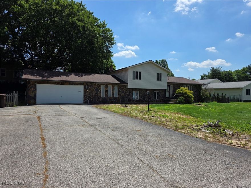 Beautiful 3 bedroom 2 full bath 4 level split in Brimfield! Upon entering the home, you will find a large open concept living room, dining room and kitchen. Gorgeous stone countertops with new stainless steel appliances. Sliding glass door leads out to the partially fenced in backyard with a small deck and patio area, perfect for entertaining. On the upper level, you will find 2 good sized bedrooms, with the primary boasting a large gas fireplace. A stunning fully renovated full bath with soaking tub and standing shower complete this level. The lower level includes a large den, another fully renovated bathroom and a 3rd bedroom. This level also gives you access to the attached 2 car garage. In the basement you will find a bonus room as well as your utility room with washer and dryer. Tenant pays all utilities. Renters insurance is required and is included in the price of rent. Pets allowed with additional pet rent and deposit.