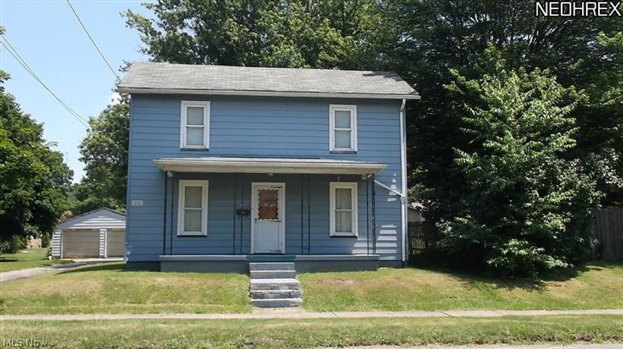 2 story aluminum sided home with newer windows. Eat in kitchen, living room, master bedroom and full bath on main floor.  Two additional bedrooms on second floor.  1 car detached garage. Just a few blocks North of downtown shopping.