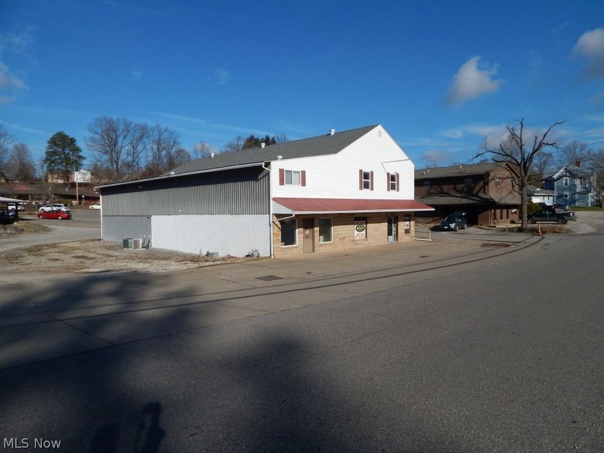 GREAT COMMERCIAL PROPERTY IN HARRISVILLE!  After years of serving the people of Ritchie County, the Starr Woodworking family is hanging up their self-employment hats and trading them in for fishing hats. Large, corner lot with the potential for opportunity!  Parking isn’t a problem since there is space surrounding the main building.  Over 3,000 sq. ft. of retail space, 11,000 sq. ft. of warehouse space and a 2,400 sq. ft. work shop and it is all on a corner lot in Harrisville! The Taylor 1,000-gallon wood burning hot water furnace heats the retail area, office and wood working shop!  No need to worry, as backup, there are two forced air furnaces with a/c that can heat and cool!  The main building could provide a retail space, offices, or even headquarters for an Oil and Gas company with buildings already in place to store some job site equipment!  Call for more details about this property!