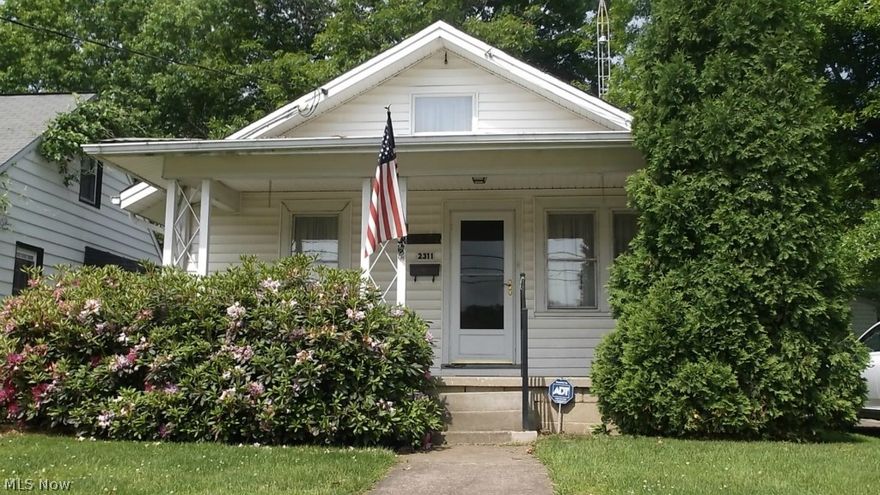 Welcome to this charming ranch with covered front porch on quiet street and back yard with an awesome view of the Baseball Field.  This home features and addition in 1972 that is the third bedroom, but could be used as a Den or for a Dining Room, which would make the Living Room much larger by extending into the current Dining Room area.  The home has gutter guard, glass block windows in basement, a security system and updated Bath.  The Attic area is a cozy area for crafts or child play area--has lots of storage.