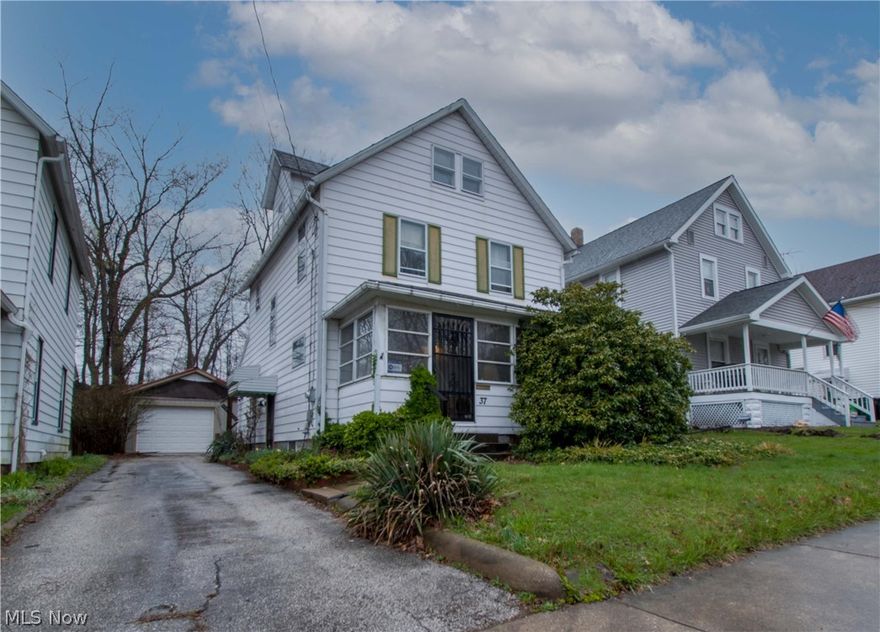 Four bedrooms, 2.5-story Colonial home in the City Of Barberton. Original woodwork & wood flooring --enclosed front porch (19 x 7). Nice size eat-in kitchen with french doors leads to the brick patio and private backyard—First-floor bath with a walk-in shower and stackable washer & dryer hookup. The second floor offers three bedrooms and a spacious full bathroom, and the finished attic is the 4th bedroom with built-in shelves and a large walk-in closet. The full basement has glass block windows and a 2nd laundry hookup with a utility sink. Make an appointment for your private showing today!