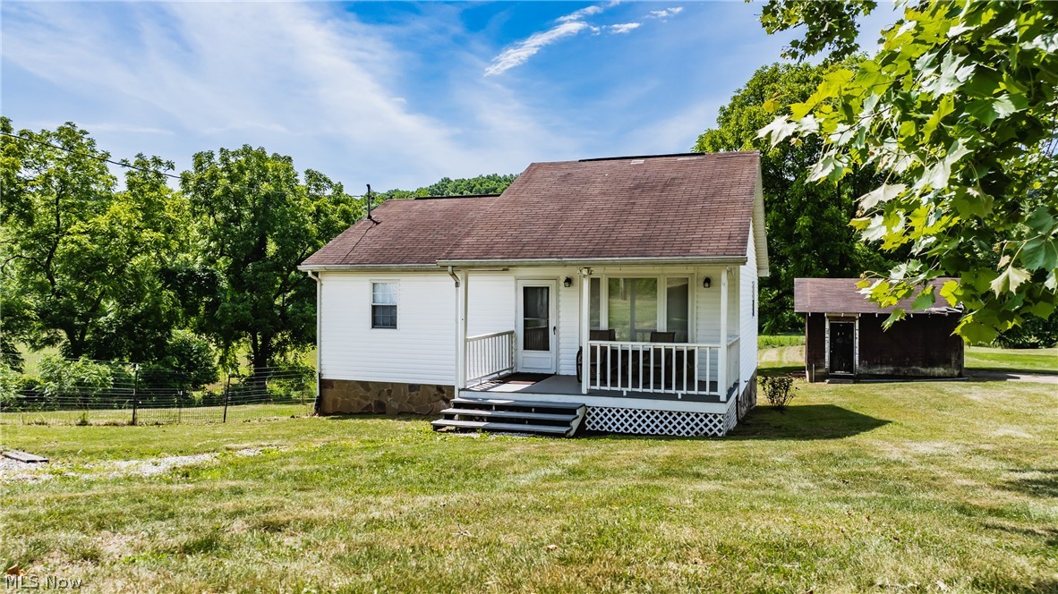 Discover the charm of this cozy 1-bedroom, 1.5-bathroom home nestled in a peaceful country setting, yet just minutes from Belpre and Parkersburg. This inviting residence has been thoughtfully updated over the years, featuring a modern kitchen with all stainless steel appliances (new in 2018) and a new gas water heater installed in 2019. Enjoy the convenience of both free gas and metered utility, easily switchable, along with a forced air gas furnace, central A/C, and a backup ventless heater in the basement. Situated on a generous 4.53-acre lot, this property includes a spacious backyard and a versatile garage apartment built in 2007. The apartment offers 2 bedrooms, a bathroom, an open kitchen/living room, and a laundry/utility area off one bedroom. It’s perfect for rental income, a mother-in-law suite, or conversion back to a garage. The main house boasts a large bedroom with attic access for ample storage, additional storage in large closets, and an outdoor building with a lean-to shed. The partially finished basement is ready for your choice of carpet or flooring to create additional living space or a second bedroom. The basement also includes a laundry/utility room with a shower and toilet, with easy installation of a wash sink. Enjoy serene views of the large back field, frequented by wildlife, and take advantage of the makeshift hunting blind overlooking the field and creek in the back corner of the property, perfect for deer hunting. Don’t miss out on this charming home with plenty of possibilities!