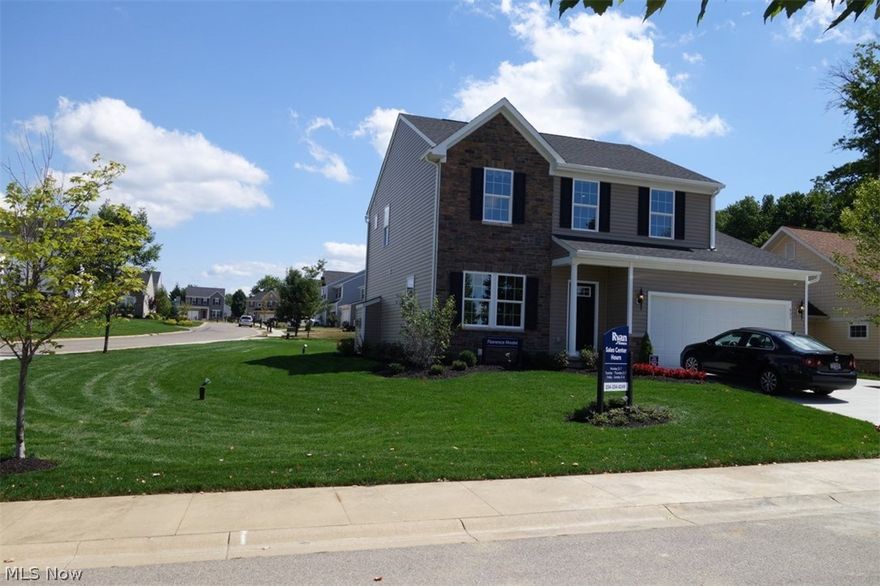 It doesn't get better than this - this home has been used as a Ryan Homes model - which means it is beautifully decorated inside and out, is impeccably maintained,  and the only room really used is garage (used as sales office)!  This Florence floorplan offers just the right amount of space, with 3 bedrooms, and a spacious, multi-purpose loft on the 2nd floor. The foyer opens up immediately into the light-filled dining room/living room combination. A coat closet is discreetly tucked away between the hallway and the main level powder room. The family room is large enough for any size family gathering, and features a classic granite fireplace. The kitchen is the showstopper in this home - it features the 9' ceilings like the rest of the 1st floor, and is open to the Morning Room.  The Morning Room is what sets this house apart from other houses - it is filled with natural light from the side & rear windows, double french doors leading to a custom patio, and a breathtaking cathedral ceili