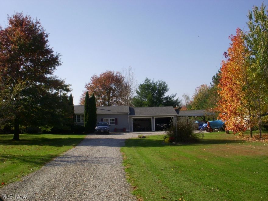 Room to roam on nearly 3 acres of beautifully landscapped property!  This home has so many updates and features, you will want to make it yours!  Pella windows thoughout * hardwood floor in the family room (2014) with a beautiful wood burning stove * complete roof tear-off with shingles that are resistant to high wind (8-10 yrs young) with a 30 year warranty * central air (8-10 years young)* granite counter tops in the kitchen (2008) with Pergo flooring & updated cabinets * 2 tier deck overlooking a nicely landscaped & treed yard * Transferable lifetime warranty on waterproofing & sump pump (w/ battery backup) * 85 gal hot water tank (2013) with lifetime warranty * stamped concrete covered patio w/ ceiling fan * 220 line in both garages * Garage 2 is a 24x24 Pole Barn *  Cistern for exterior watering/car washing/etc. * Only 30 minutes to Great Northern Mall!  * Home Warranty.   The washer, dryer, upright freezer, compressor in garage, antique gas pump, dog run do not stay.  Motivated s