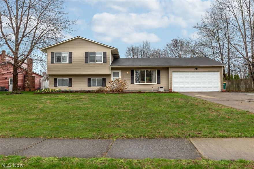 WELCOME HOME! This lovely split level home has so much to boast about.  Large windows in both the living and dining room make entertaining a dream and bring the outside in! The large, eat-in kitchen has been updated with new cabinets, appliances and countertops. Just off the kitchen is a sizeable mudroom, perfect for making yourself at home when you enter or exit through the 2 car garage.  Both full bathrooms have also been beautifully updated from top to bottom. The 4 bedrooms are bright and spacious and provide ample room for storage. Entertaining outside is a dream with the covered patio, large backyard and above ground pool! Nothing to do but move right on in just in time for summer!