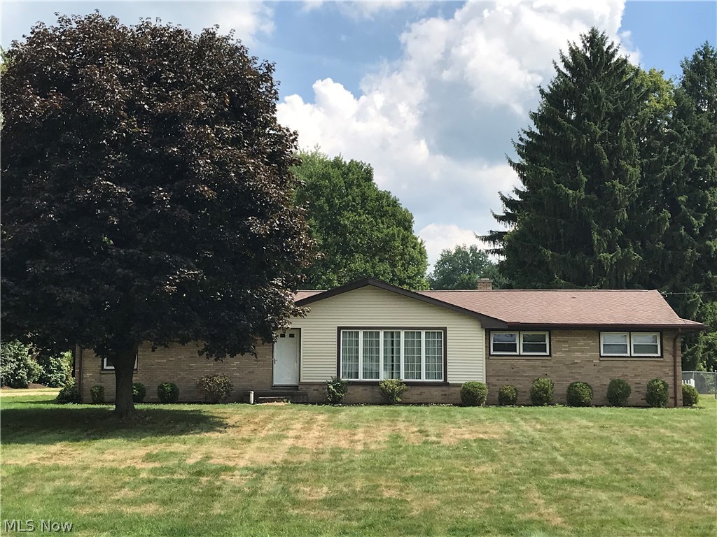 This brick ranch sits on over half an acre and features three bedrooms, two bathrooms, a bonus room and workshop in the basement, as well as a fenced-in backyard with an in-ground pool. The house sits back from the road which allows for a sprawling front yard and some privacy in the backyard and pool area. The 18x36ft in-ground pool features a slide and diving board perfect for enjoying the luxury of pool entertaining without leaving the comfort and convenience of your home. The front living room boasts floor-to-ceiling windows that allow for an abundance of natural sunlight. The main floor of the home has been freshly painted and both bathrooms have been redone for an updated, more modern look. The basement bonus room is large enough for additional living or entertaining space and features a workshop area in the back for those looking for space to do wood-working, crafts, or just needing additional storage. For ease of mind, the sellers have provided a home warranty for the new buyers and have had the home professionally cleaned by Finishing Touch cleaning service! Book a showing today and make this ranch your forever home!