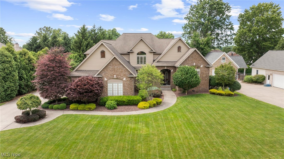Custom-Built Home in Canterbury Creek. A thoughtfully designed and beautifully maintained custom home offering over 5,500 sq ft of refined living space. Step through the leaded-glass entry into a soaring two-story foyer accented by an ironwood balustrade staircase.
The great room stuns with a wall of arched transom windows, coffered ceilings, and a striking fireplace, the perfect backdrop for everyday living or elegant entertaining. The open floor plan flows into a chef-inspired kitchen equipped with state-of-the-art Dacor appliances, maple cabinets, an expansive granite island, and a warm, inviting dining room with hardwood floors, crown molding, and accent lighting.
A few steps up, the spacious primary suite offers privacy and luxury with triple tray ceilings, accent lighting, dual built-in closets, and a spa-inspired bathroom featuring a soaking tub, walk-in tile shower, and dual vanities. Adjacent, a library-style office with vaulted ceilings, floor-to-ceiling built-ins, and arched windows makes working from home a dream.
Another set of stairs leads to the upper-level, complete with three generous bedrooms, two full baths, and a flexible bonus room, perfect as a fifth bedroom, media room, or music space.
The walk-out lower level is built for entertaining, with a full bar, cozy fireplace, game area, a full bath, and exercise room, all opening to a beautiful paver patio. Enjoy premium audio with built-in Bose sound system wiring throughout key living spaces. Outdoor architectural/landscape accent lighting with timers.