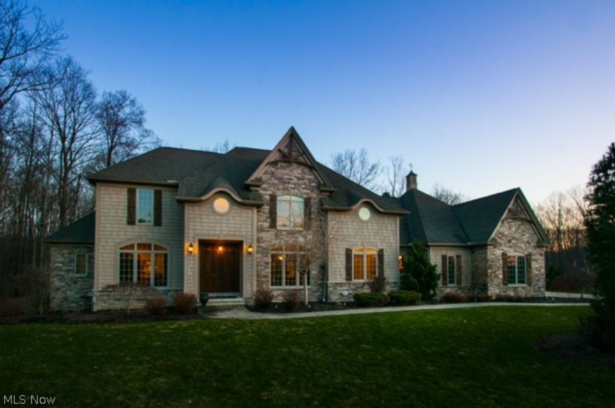 Smashing Transitional French Country Contemporary Estate situated on over 4 private acres. 4300 Square Feet on the first two floors, and nearly 2800 finished square feet in the lower, walkout level. Ideal home for a teen suite or an in-law suite. Amenities include a custom Amish maple kitchen, Brazilian cherry wood floors, first floor owners suite, walk in pantry, wine bar, butler pantry, two story living room with soaring ceilings and walls of glass, a large first floor laundry room, a front and back staircase, granite counter tops in kitchen and baths, two fireplaces, first floor office, composite deck, patio, and upgraded trim. Lower level boasts a recreation room, full kitchen, dining room, theater room, wine cellar, workout room, and a possible 5th bedroom. Most appliances stay. Lovely cul-de-sac location.