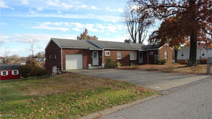 Spacious, rambling ranch on almost half an acre in a great neighborhood.  3 bedrooms and 2 full baths on main level. Living and dining areas comprise a huge open "L" shaped area, with doorway to covered 12x18 deck overlooking back yard.  Enormous combination library and family room in the walk-out basement, with its own half bath.  Large laundry area containing the furnace can be closed of with nice wooded louvered doors.  Gigantic workshop off the family room for all your project and storage needs. 
 Oversize 1 car garage with oil change room underneath.  Large yard is easy to mow, and provides plenty of space for kids or pets. 
 Located on a dead end street, yet convenient to shopping and hospital.  Selling "As-is".