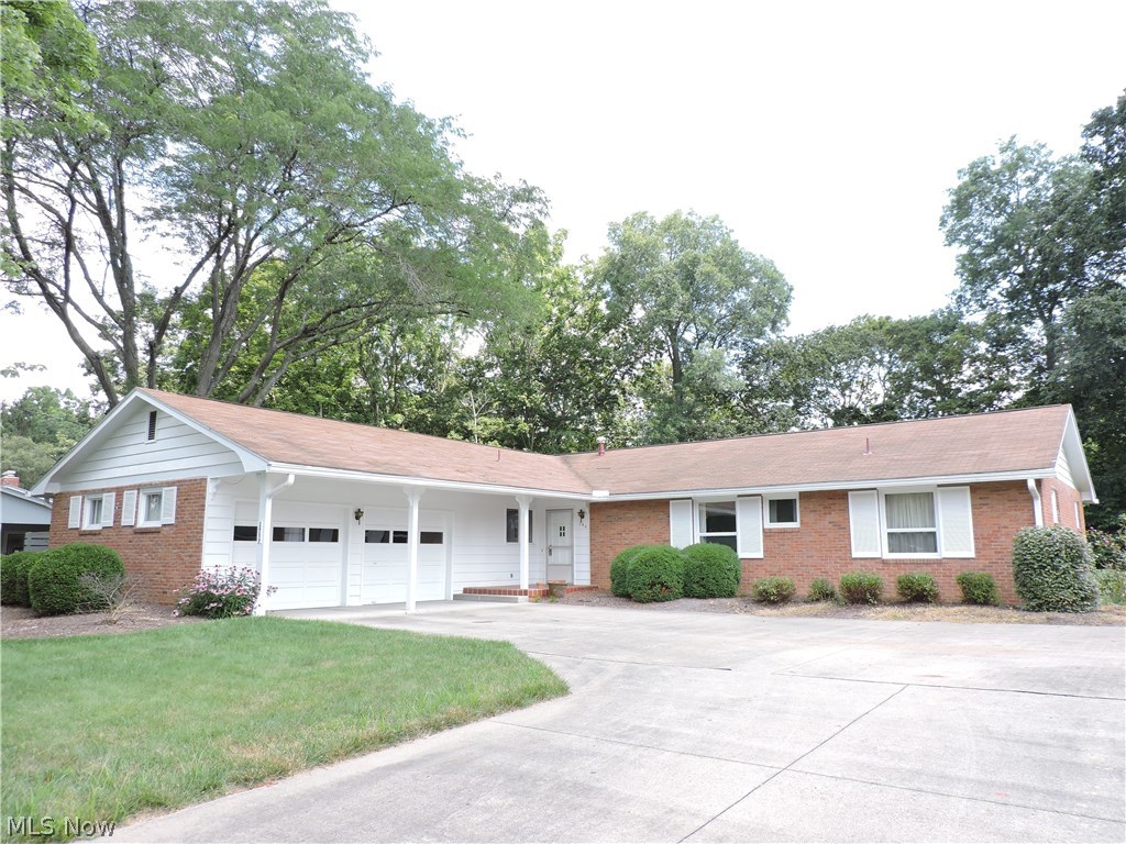 This 4 bedroom, 2 ½ bath, brick ranch with great curb appeal, has been well maintained and offers an open floor plan. Features foyer with guest closet and hardwood flooring, light and airy living room with wood burning fireplace (gas start), hardwood flooring and built-ins, formal dining room with space for a large table and great wall space for hutch, kitchen with abundance of custom cabinetry, table space, wall built-in, appliances, (gas range top, refrigerator, dishwasher), inviting Florida room with recessed lighting, window walls, door to patio area and private backyard, 4 bedrooms with hardwood flooring, 2 full baths (master with shower and hall with tub/shower). The first floor could easily offer laundry, if needed. The walk out partial basement features a large rec room, half bath and laundry area. The home has gas forced air heat with central cooling system, hardwood flooring, abundance of storage, level lot with woods in back, PUBLIC SEWER, 2 car garage and great off st
