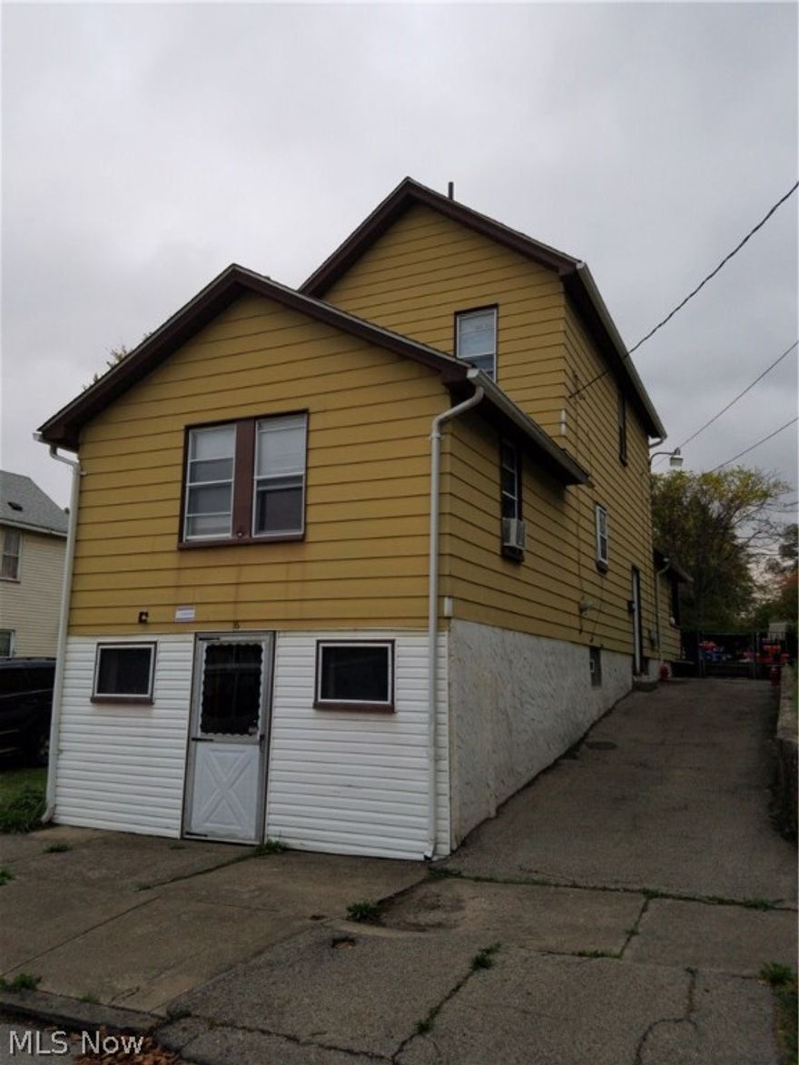 Unique Home, was originally a store front with very nice living quarters upstairs. Now it's all residential and you have 3 levels of finished living space plus a great fenced in back yard and a vacate lot beside you. The 2 bedrooms on the top level share a 1/2 bath, the main floor has a modern stylish full bath and the lower level that is walk out at ground level had a full bath with claw foot tub, which isn't functioning today. Main floor has large rooms and adorable back porch surrounded by fenced in yard. There is a kitchenette on lower level and a rec. room and another room that is used as a bedroom. Come and see ow this works great for growing families! Good Tenant is occupying property now, paying $585/mo.