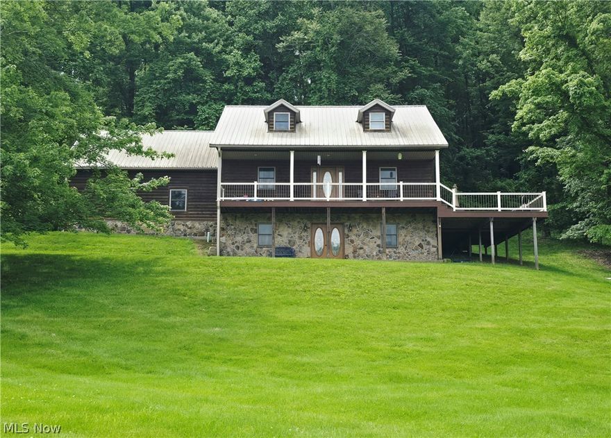 Stunning home situated on 3.5 acres, offering space, functionality, and versatility! The main level features a large open kitchen with beautiful hickory cabinets, sitting room, dining space, laundry room, and a convenient half bathroom. The primary suite is also located on the main floor and includes a huge walk-in closet and full bathroom with walk-in shower. Upstairs, you’ll find two bedrooms, one large bonus room, and an additional full bathroom with jetted tub. The finished walk-out basement has a beautiful nature stone entryway and offers a cozy family room with fireplace, finished bonus room, and a third full bathroom with walk-in shower. The large wraparound deck is perfect for relaxing and entertaining. This home also features an attached two-car garage, impressive 30x50 detached garage with space for up to four vehicles, and a whole house generator. Don't miss the chance to call this beautiful home yours. Call today for a private tour!