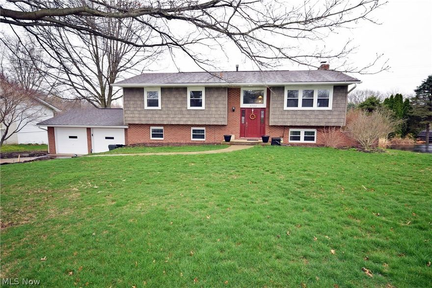 This one is a must see! Open the front door and you'll know this is the right one! Open floor-plan with large remodeled maple kitchen(2009), open to the living room and dining area with a patio door leading to the deck.  New white painted trim throughout the entire house. This home has great curb appeal with new windows(2012), new vinyl shake siding(2012), new patio in the backyard. New carpet in the lower level, family room features a beautiful fireplace with white built-in cabinets and walks out to the patio. Lower lever also includes a full bathroom, 4th bedroom area, laundry area and a large workshop space.  The shed in the backyard will remain.  This home is a great value and will sell fast so schedule your showing today!