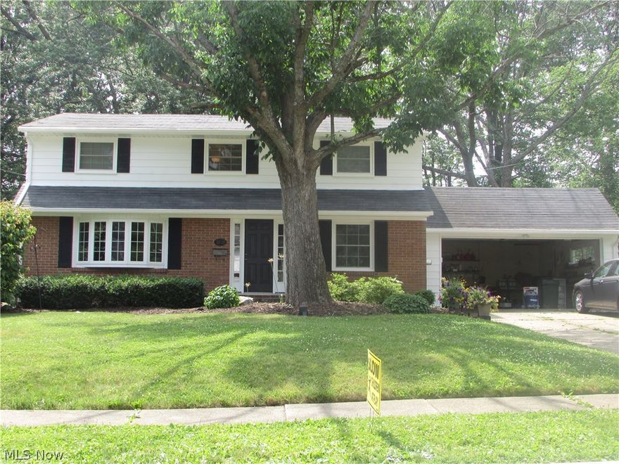 4/2.5 colonial with 2 car garage and updated.  partially finished basement.  Screened porch.