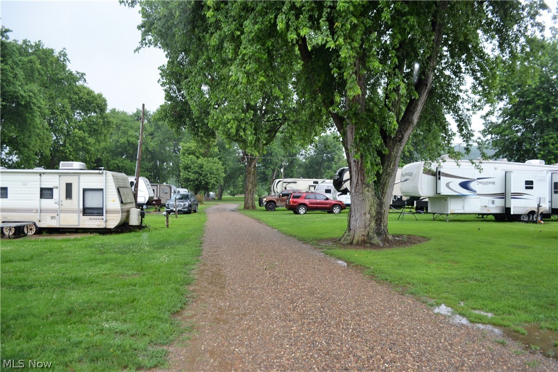 I have found Meigs County's hidden treasure!! Come fall in love with an opportunity that awaits you at the immaculately maintained Old Lock 24 Campground! Whether you're looking for an excellent investment or fulfilling a dream of owning 4 riverfront acres, this is the property for you. Enjoy 50 campsites with all utilities, 28 of which are riverfront. Bath house, laundry and rec room for all to enjoy. You will have your own marina for launching and docking boats. Plenty of space for tent camping, playing cornhole, fishing or simply sitting around a firepit and relaxing. The icing on the cake is the nearly 5,000 square foot building which offers a beautiful studio apartment that's been recently updated! The possibilities are endless with space for receptions, weddings, parties, food vendors or just about anything you can imagine. Dock with electric also goes with the property. Call today for more information or to set up your own personal tour of this once-in-a-lifetime opportunity!!