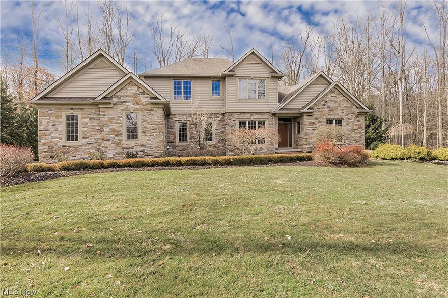 You have to see it to believe it.  Welcome to 9735 Cumberland Trail, a captivating, custom built home nestled on 2.04 acres in Lorien Woods.  This unique residence boasts 3,414 sq. feet of living space on the first and second level with a BONUS FINISHED LOWER LEVEL adding 1,755+ square ft. to ensure comfort and style on every level at every turn. Upon arrival, you will be impressed with the home's stone exterior + professional landscaping.  The vaulted entry and cathedral ceilings are masterfully crafted for abundant natural light.   You will discover a warm and inviting interior, adorned with beautiful hardwood floors that add an elegant touch to many living spaces. The heart of this home is the elegant living room highlighted by a stately fireplace, centered around custom built-in bookcases.  The space is perfect for for entertaining and creating lasting memories all year round.  The well-appointed and gourmet eat-in kitchen is perfect for mealtime magic.   It features a professional series Viking gas cooktop and hood, Jenn-Aire built in wall oven + warming tray, microwave and a new dishwasher (2023).  There are ample granite counters for culinary enthusiasts, including two sinks.   The spacious primary suite is on the main level with vaulted ceilings and plenty of natural light. Its oversized bath features a Jacuzzi soaking tub and a walk-in shower, with two vanities and a separate water closet. Enjoy a surplus of storage convenience with the large walk-in closet. The second level features an oversized loft with built-in workspace and storage, along with two additional  bedrooms and a true “Jack & Jill” full bath with pocket doors for privacy.   The possibilities are endless for a lifestyle of comfort in this spacious. meticulously maintained home.   Enjoy the amenities of the pool and special community of Lorien Woods.  Additional details and professional sketches may be found in the Supplements.  You have to see it to believe it!